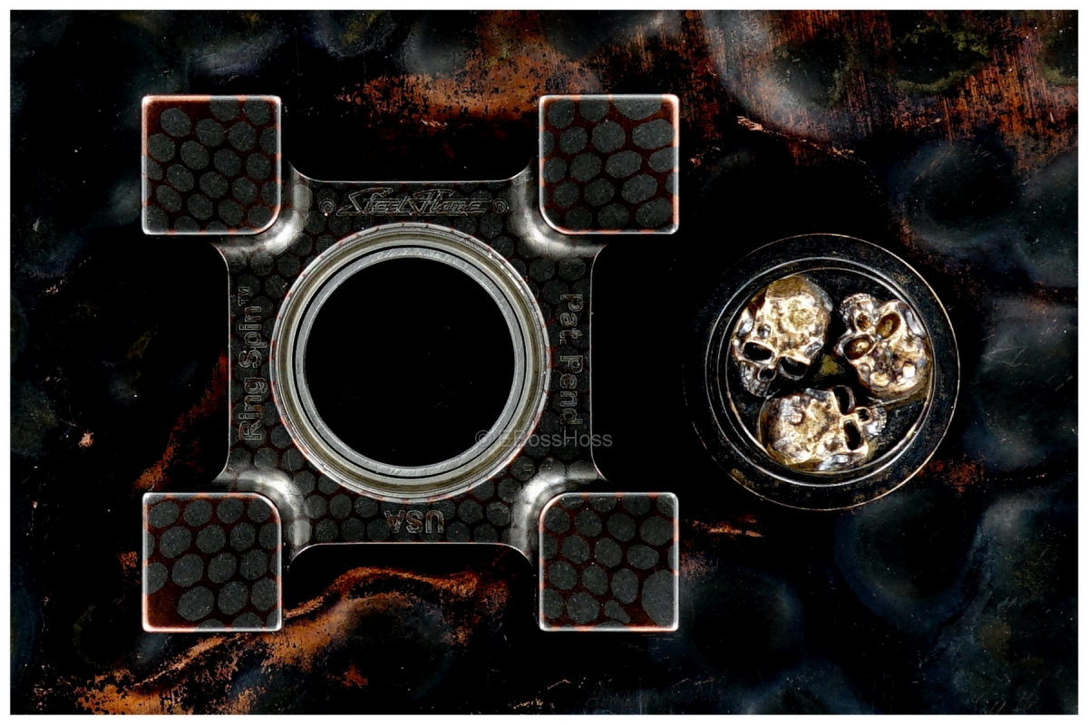 Steel Flame Deluxe Super-Conductor XL Ring Spin with Pile of Skulls Plug